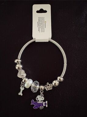 Silver Tone Stretchy Snoopy Charm Bracelet with Purple Airplane